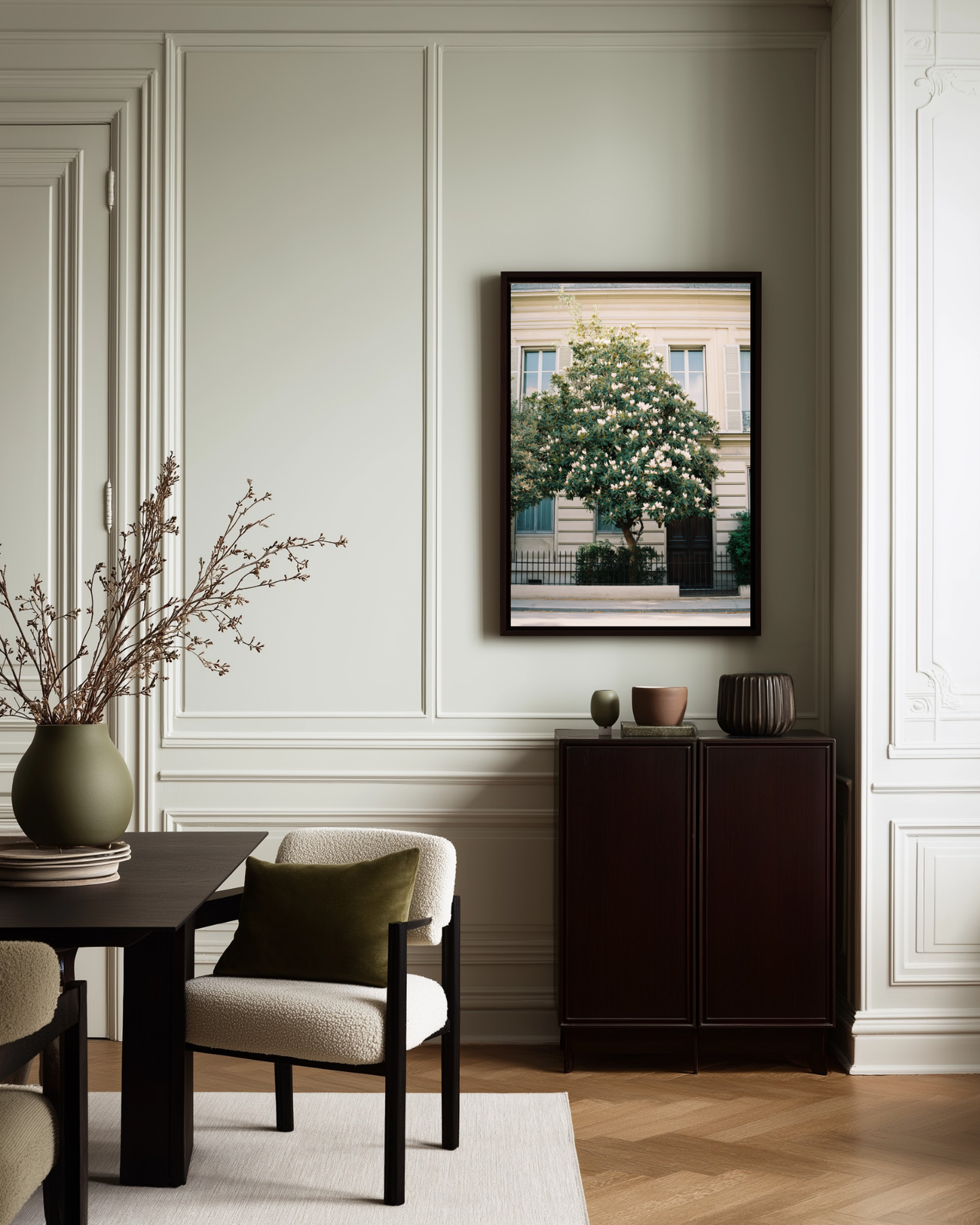 Dining room with a table, chairs, and a framed Parisian vintage photo poster on the wall.