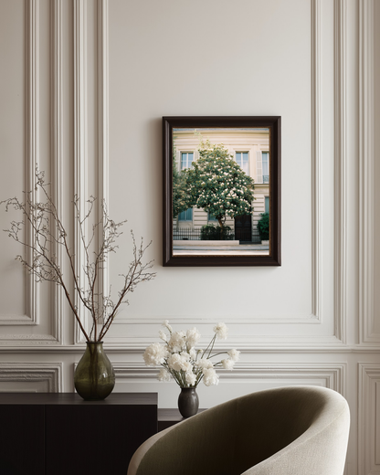 Framed artwork on a wall with decorative elements below