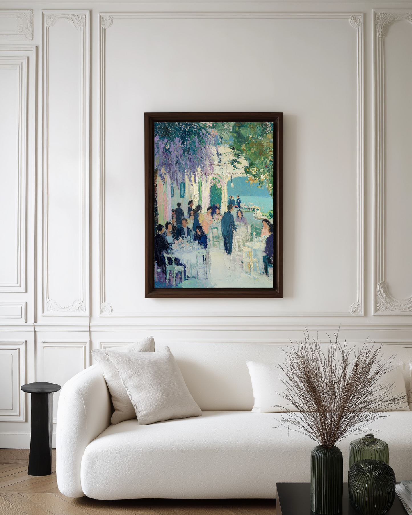 Framed painting above a white sofa in a living room with decorative elements.