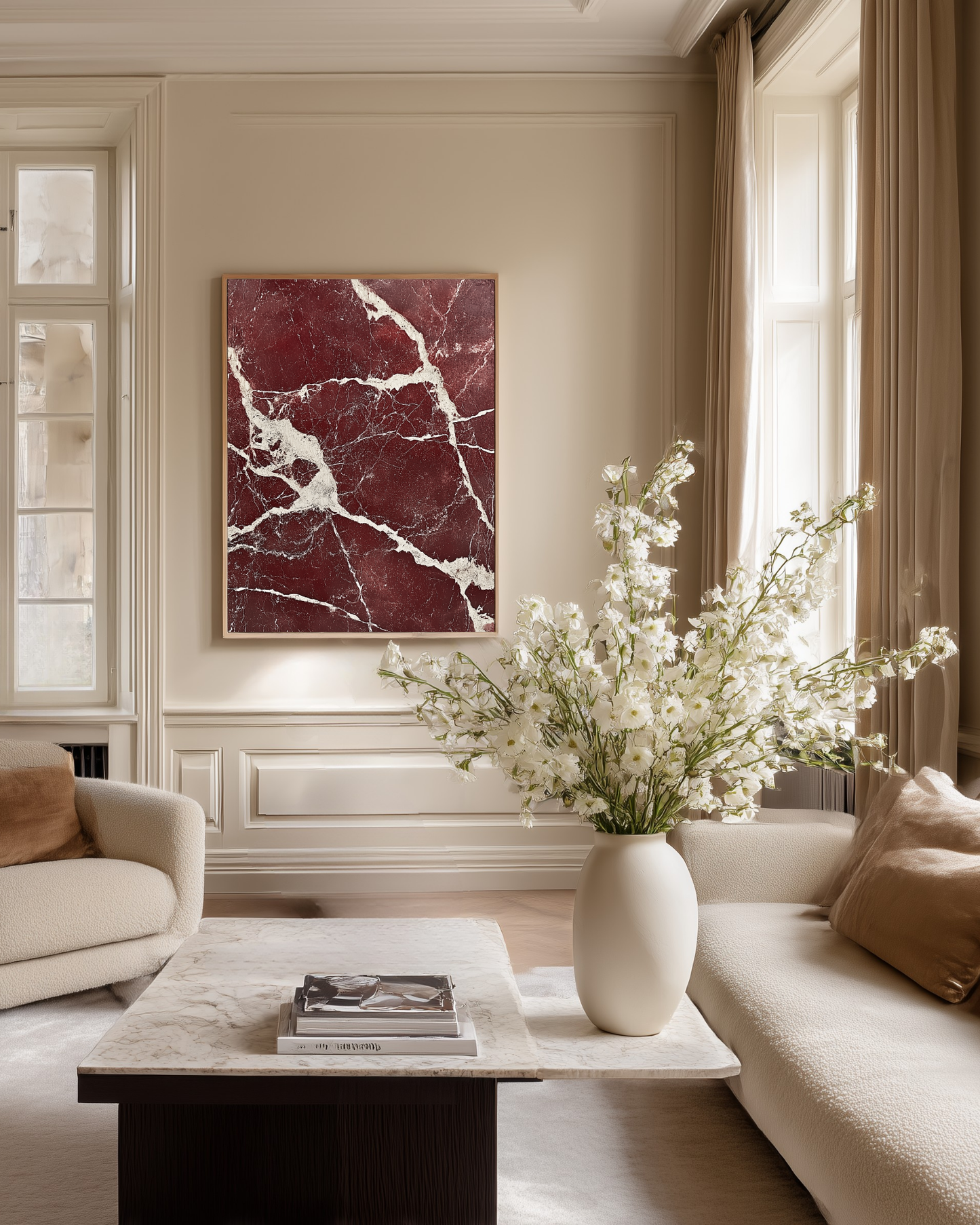 Living room with a marble coffee table, vase of flowers, and a large dark red marble stone poster.