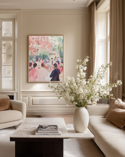 Living room with a soft colored pink watercolor painting, flowers in a vase, and a couch.
