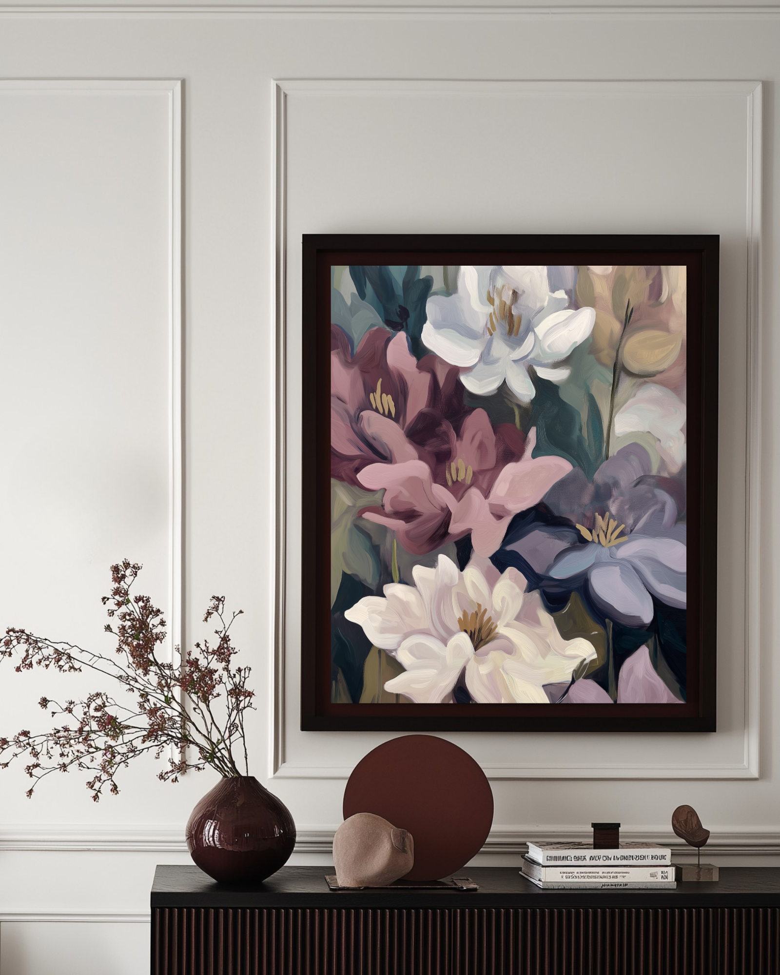 Framed floral artwork on a wall above a console table with decorative items.