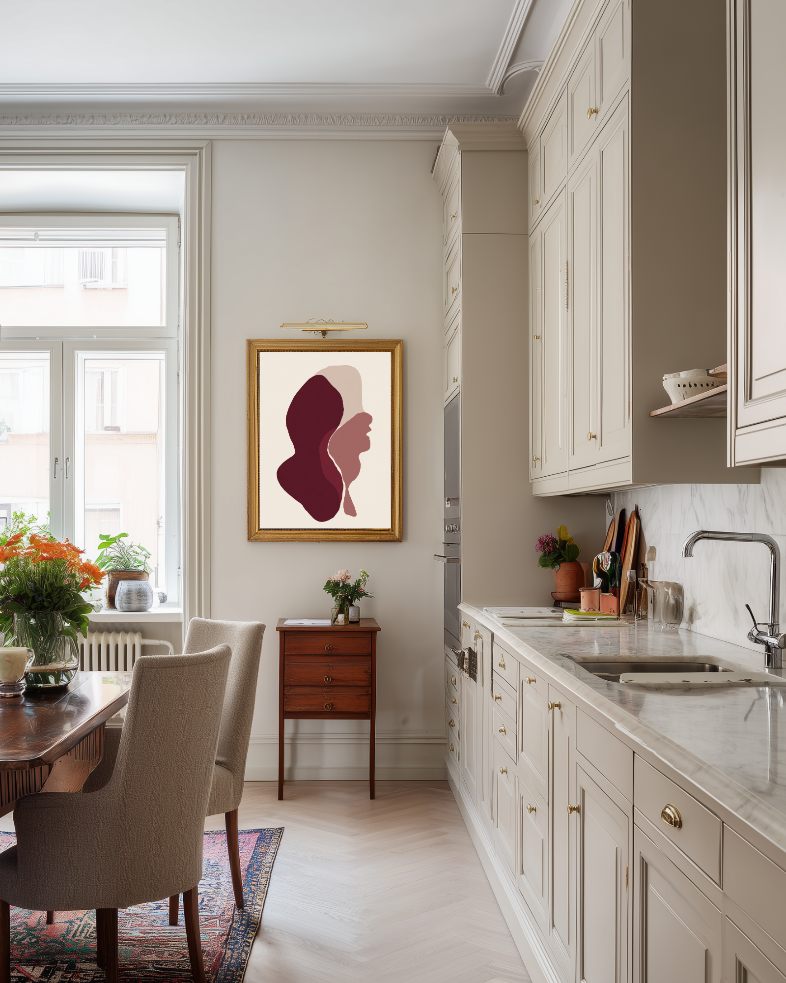 Modern Swedish kitchen with white cabinets, marble countertop, and abstract dark red art print on the wall.