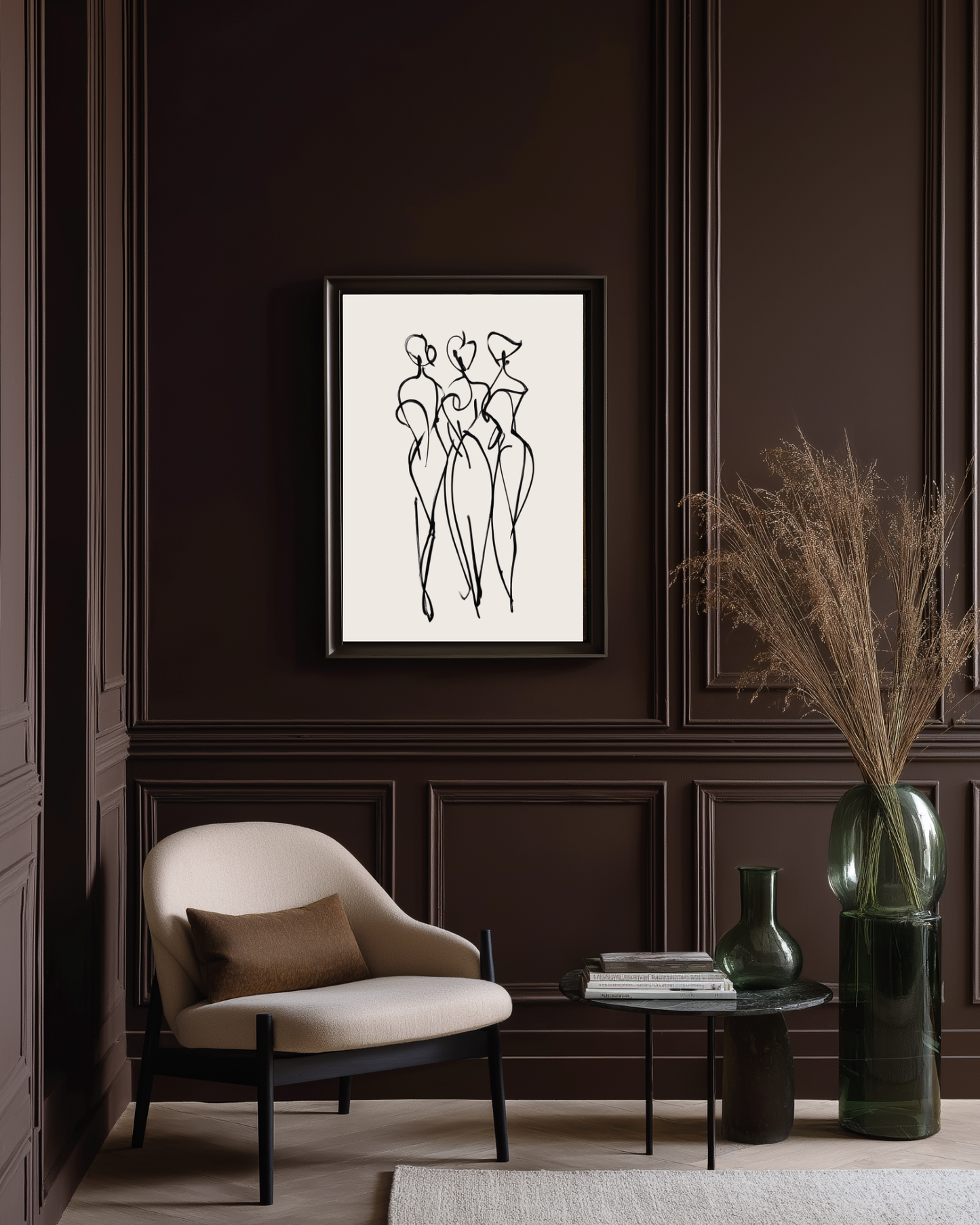 Modern interior with a framed abstract artwork on a dark wall, a beige armchair, and decorative elements.