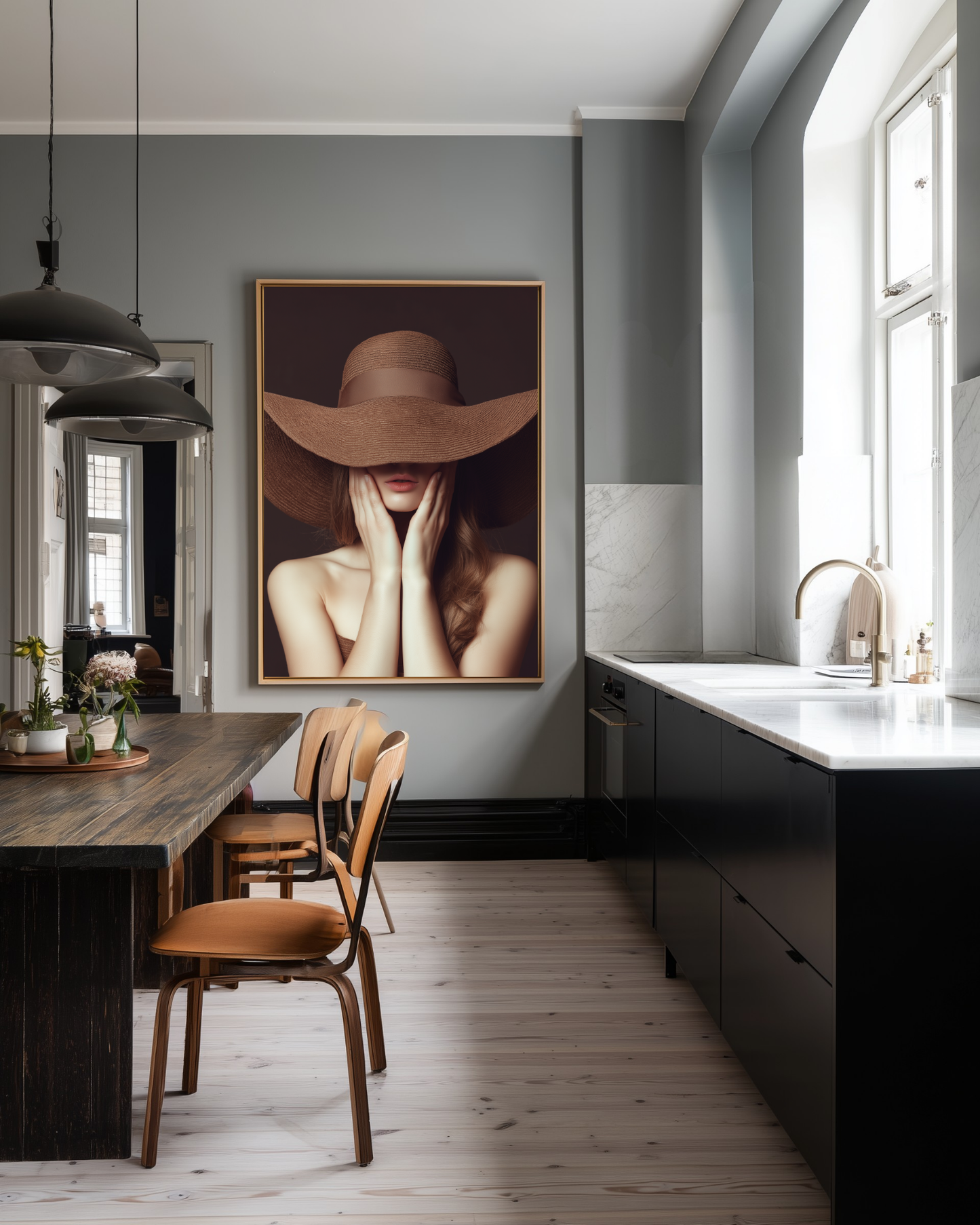 Modern kitchen with a large portrait of a woman wearing a wide-brimmed brown sunhat on the wall.