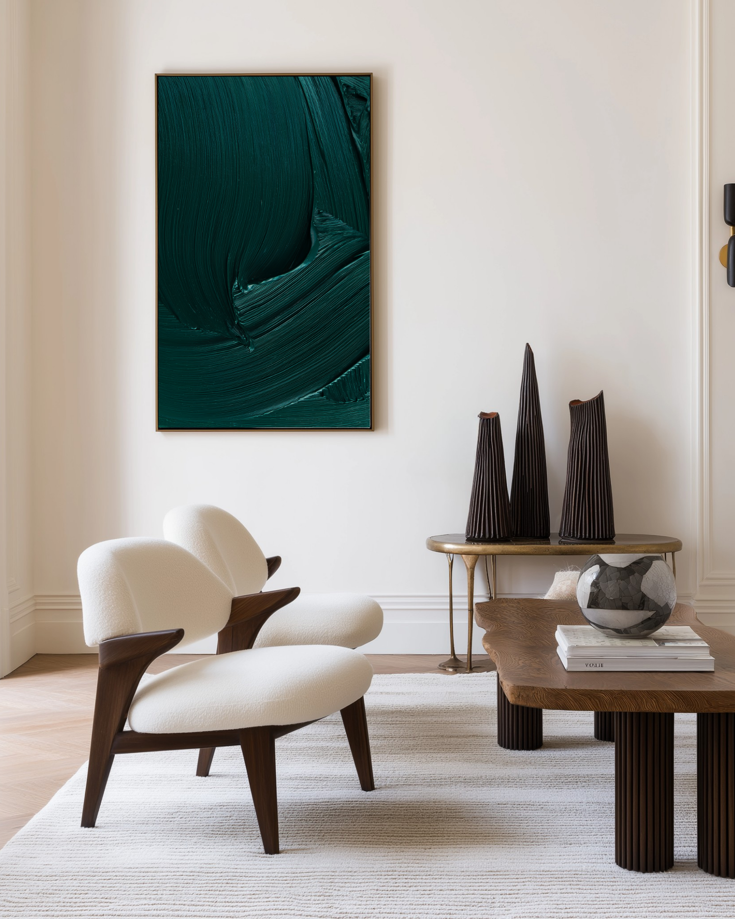 Modern living room with a white armchair, wooden coffee table, and abstract dark green artwork on the wall.