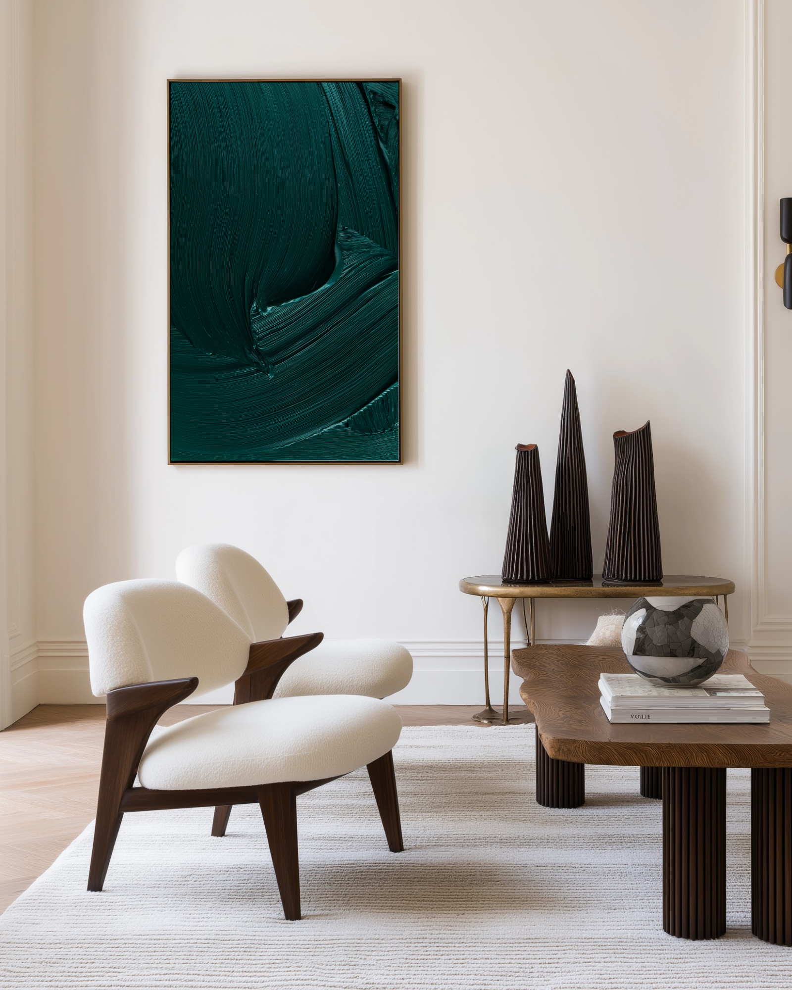 Modern living room with a white armchair, wooden coffee table, and abstract dark green artwork on the wall.