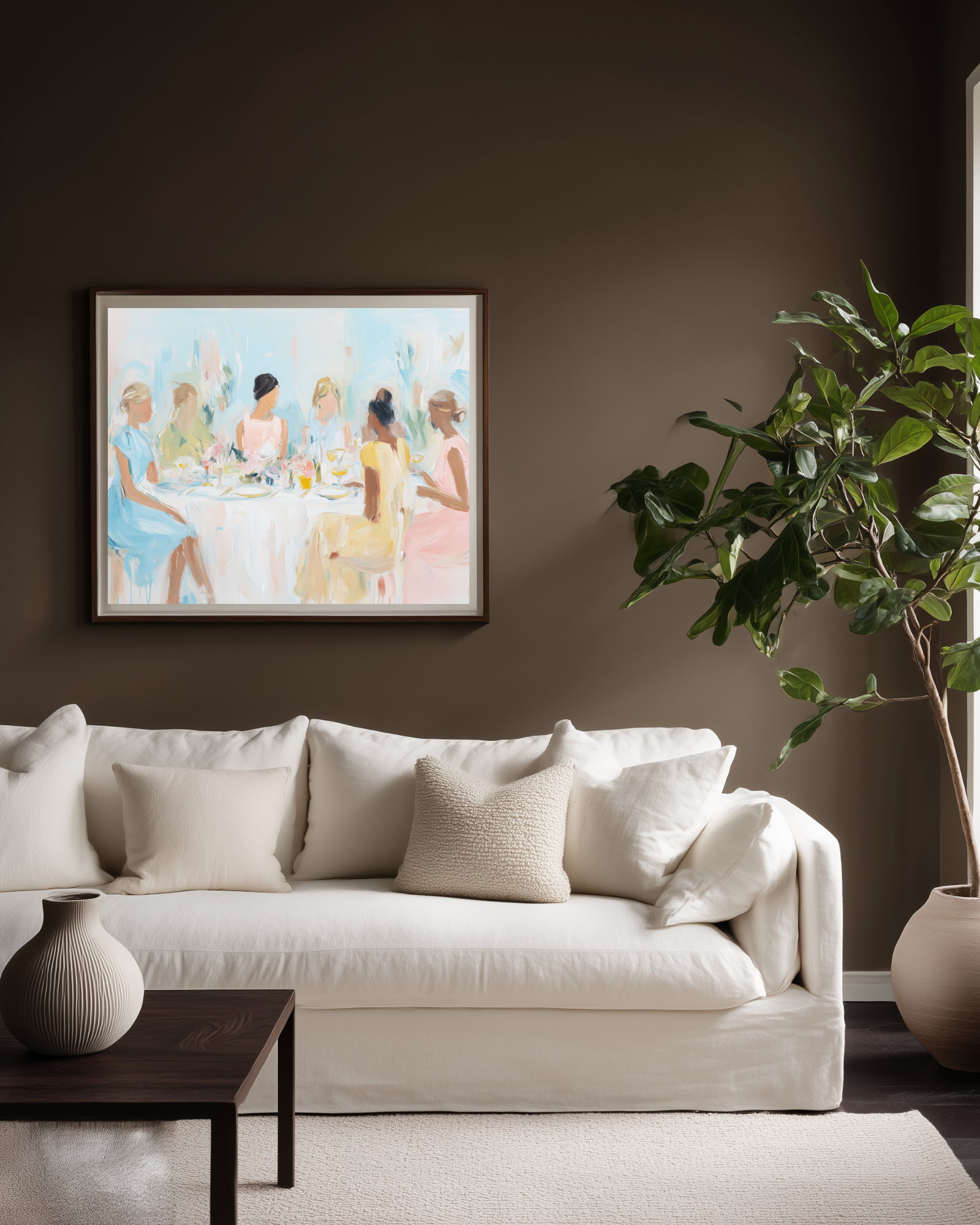 Living room with a white sofa, decorative pillows, a small table, and a pastel painting of a group of women on the wall.