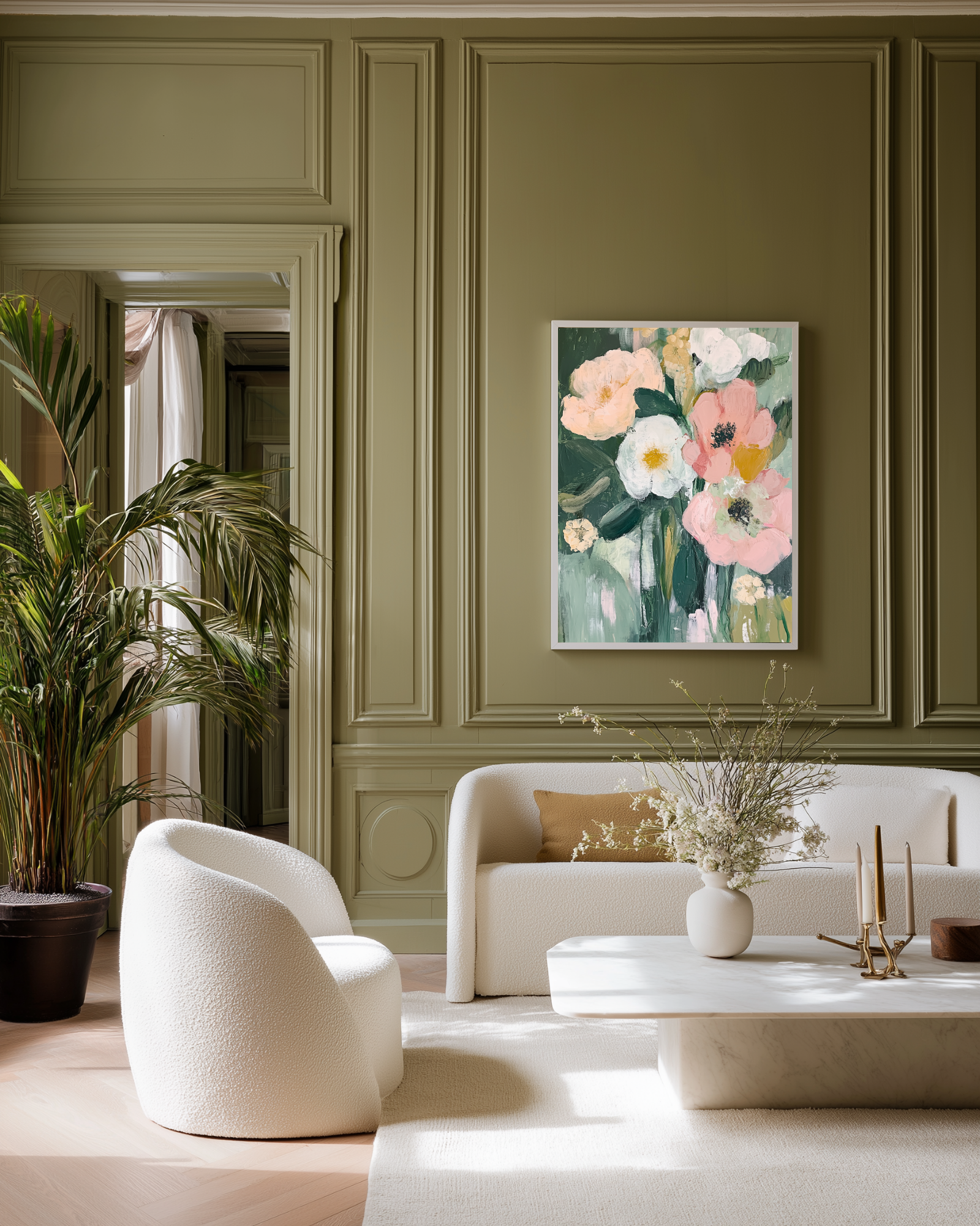 Modern living room with olive green walls, a floral painting on the wall, white furniture, and decorative elements.