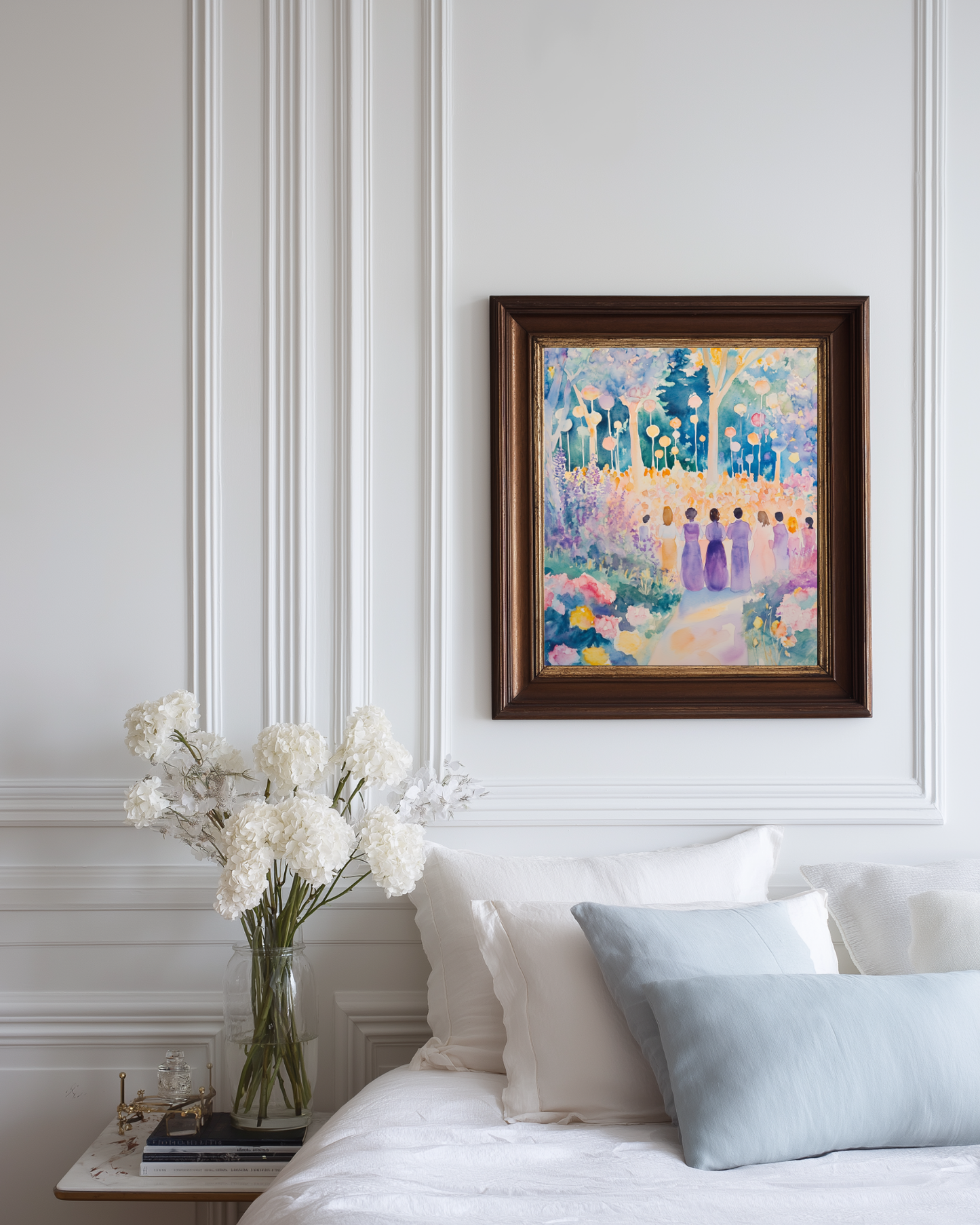 Framed purple watercolor poster on a wall above a bed with decorative white and light blue pillows and flowers.