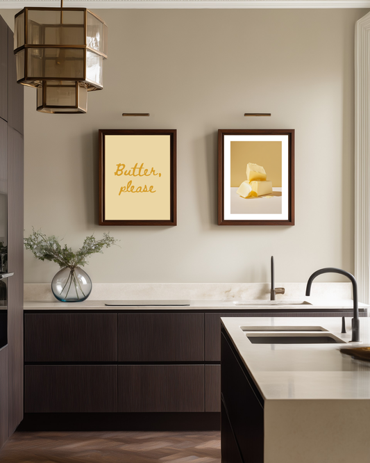 Two framed butter yellow posters in a modern danish kitchen