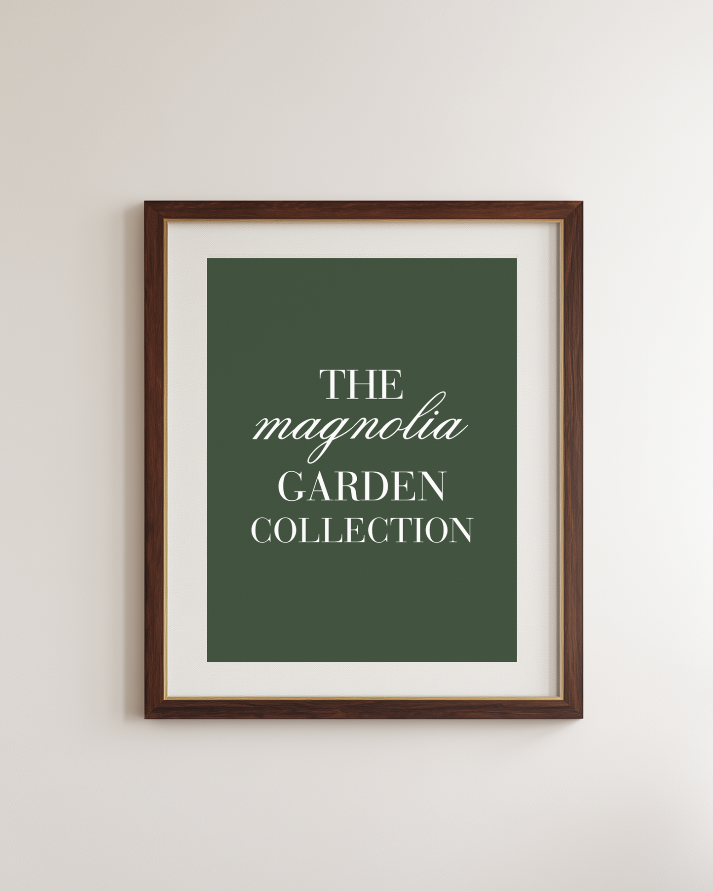 a dark green framed poster with white text "the magnolia garden collection"
