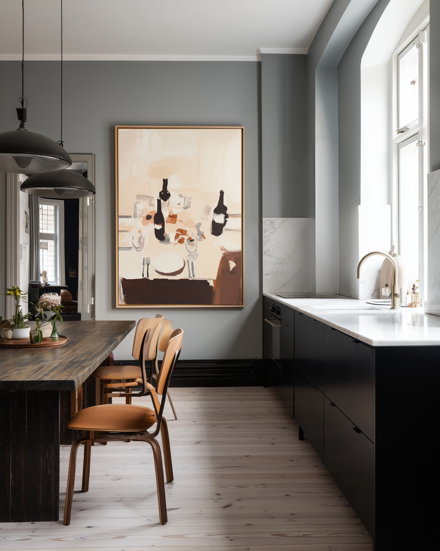 Modern kitchen with dark cabinets, wooden dining table, and large abstract beige dinner table wall art on the wall.