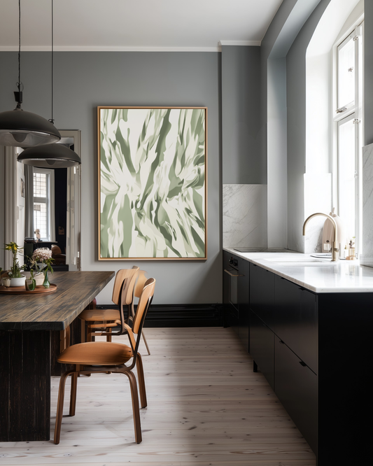 Modern kitchen with dark cabinets, wooden dining table, and abstract green artwork on the wall.