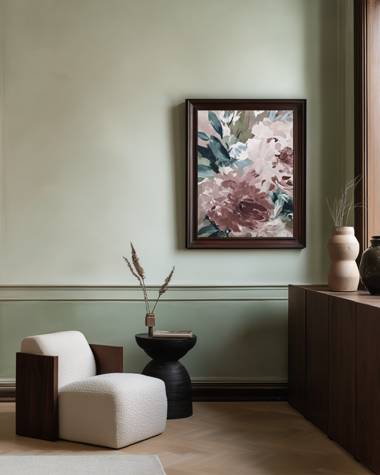 Floral painting on a wall above a modern chair and side table in a room.